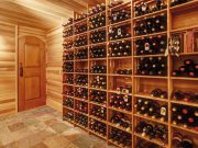 bright-home-wine-cellar-with-wooden-storage-units-with-bottles